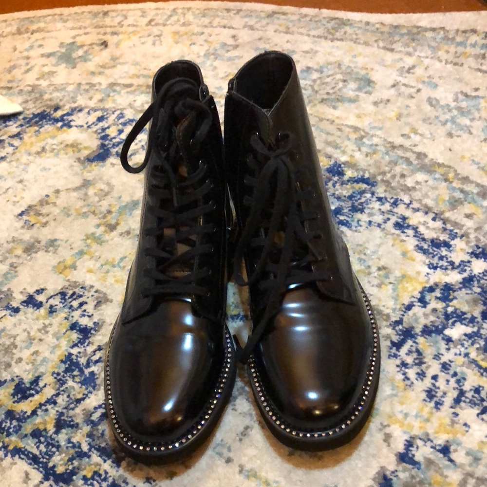 Shiny black combat boots